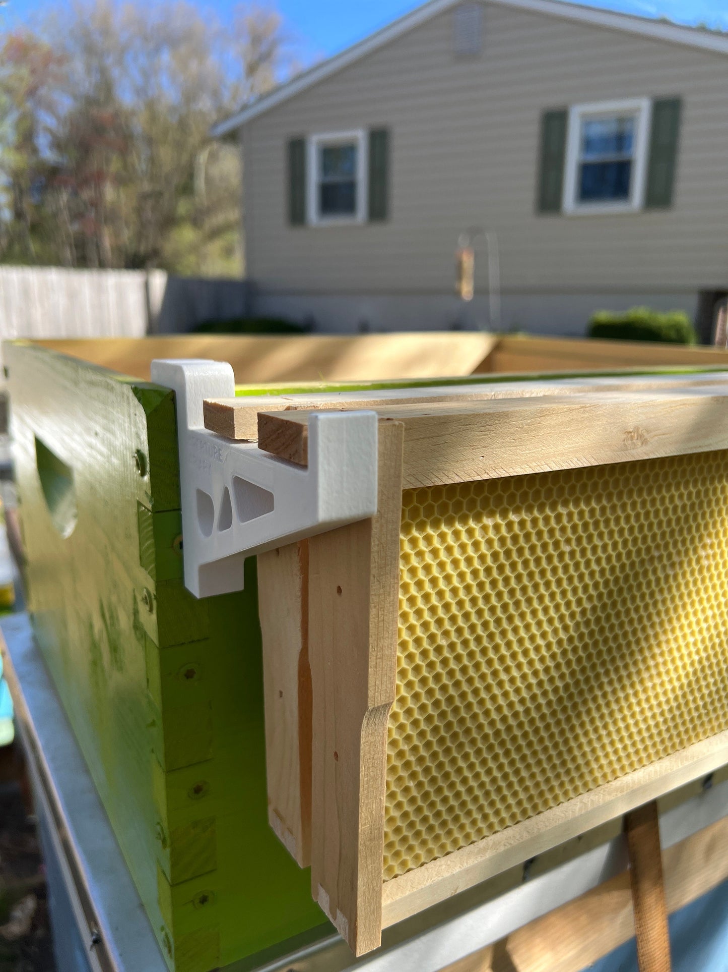 Frame holder for wooden Langstroth hives